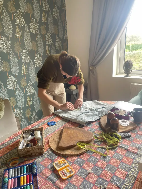 Repairing clothing fixing clothes rather than buy new